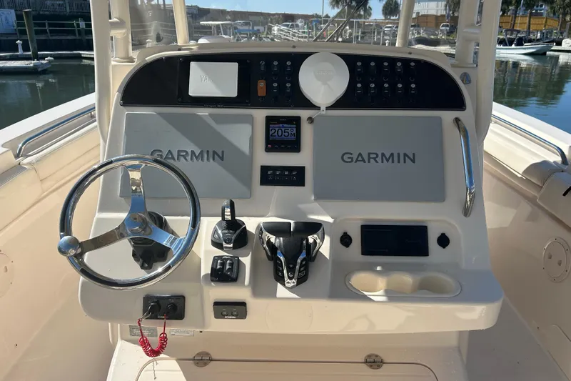  Yacht Photos Pics 2020 Grady-White Canyon 306 boat dashboard with Garmin navigation system and steering wheel.