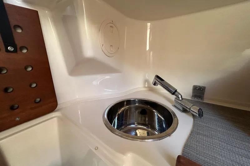  Yacht Photos Pics 2020 Grady-White Canyon 306 boat interior with sink and faucet.