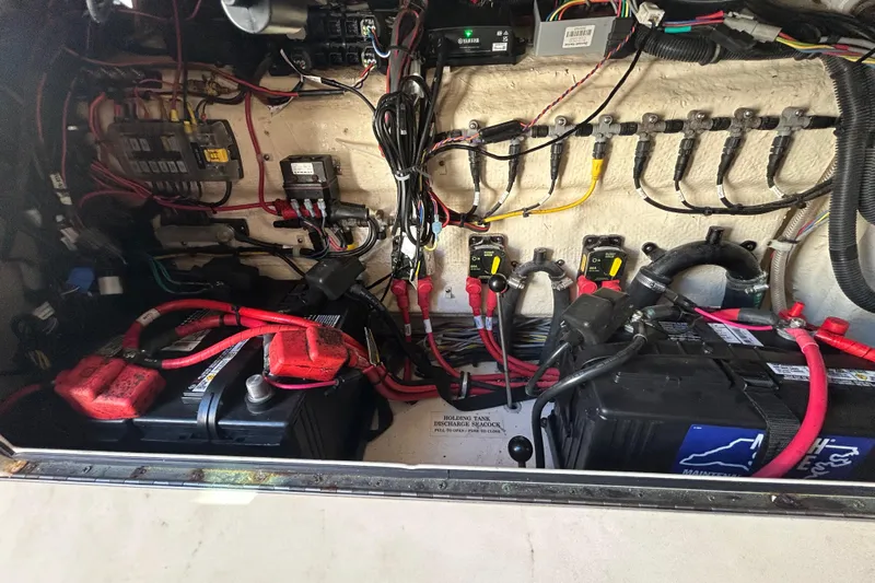  Yacht Photos Pics Electrical system of a 2020 Grady-White Canyon 306 boat, featuring batteries and wiring.