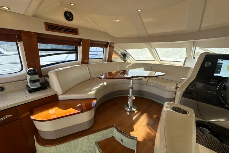 Motomar 1 Yacht Photos Pics Luxurious interior of 2008 Sea Ray 500 Sedan Bridge yacht with elegant seating and navigation area.