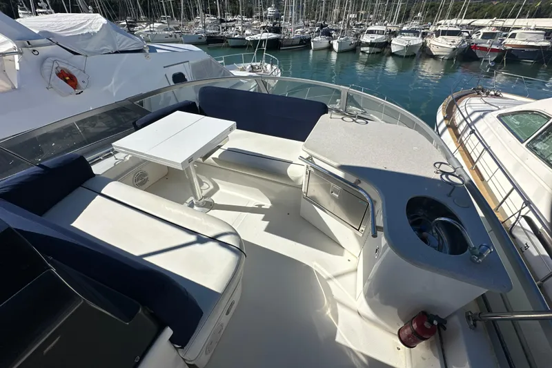 Motomar 1 Yacht Photos Pics 2008 Sea Ray 500 Sedan Bridge yacht with spacious deck and seating area in marina.