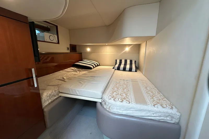 Motomar 1 Yacht Photos Pics 2008 Sea Ray 500 Sedan Bridge cabin with twin beds and elegant decor.