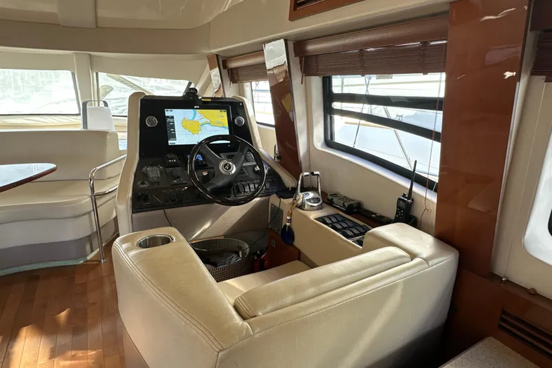 Motomar 1 Yacht Photos Pics Interior of 2008 Sea Ray 500 Sedan Bridge yacht with modern helm and navigation system.