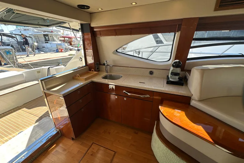 Motomar 1 Yacht Photos Pics Luxurious 2008 Sea Ray 500 Sedan Bridge yacht interior with modern kitchen amenities.