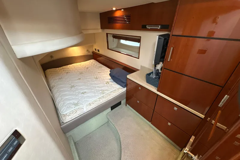 Motomar 1 Yacht Photos Pics Luxurious 2008 Sea Ray 500 Sedan Bridge cabin with elegant wood cabinetry and cozy bed.