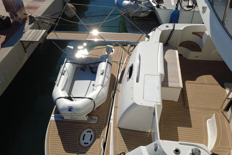 Motomar 1 Yacht Photos Pics 2008 Sea Ray 500 Sedan Bridge yacht with inflatable dinghy on deck.