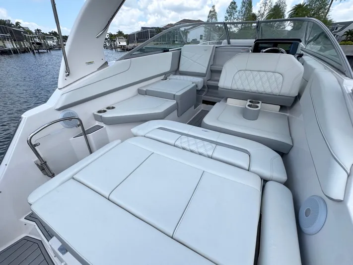  Yacht Photos Pics 2024 Regal 26 XO boat interior with luxurious white seating and modern design.