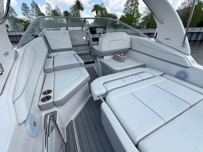  Yacht Photos Pics 2024 Regal 26 XO boat interior with luxurious white seating and modern design.
