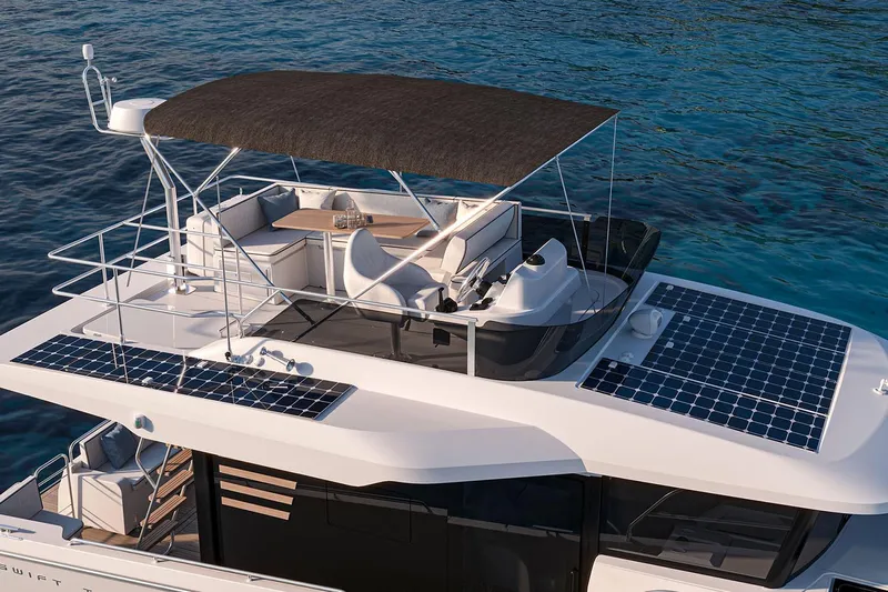  Yacht Photos Pics Manufacturer Provided Image: 2026 Beneteau Swift Trawler 37 Fly with solar panels on blue ocean.