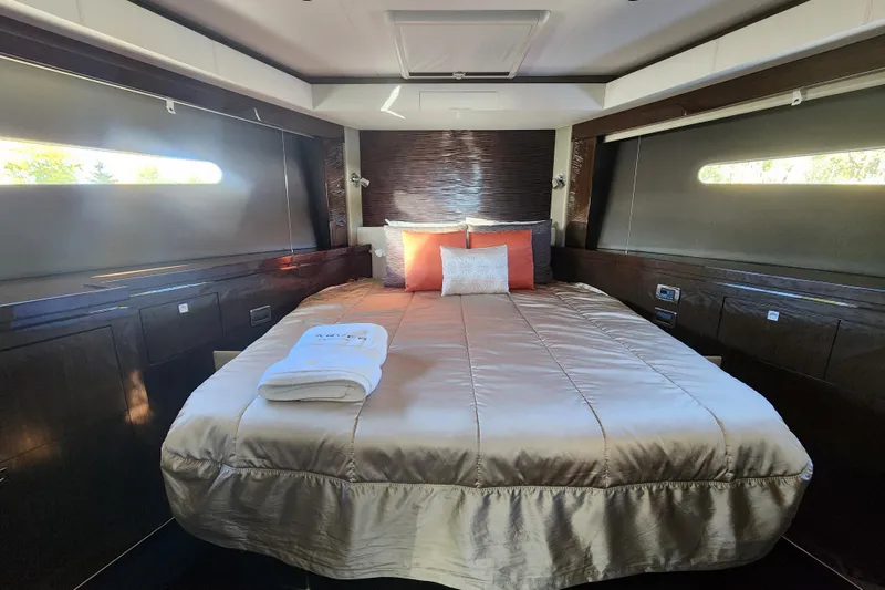  Yacht Photos Pics Luxurious bedroom interior of 2021 Carver 52 Command Bridge yacht with elegant bedding.