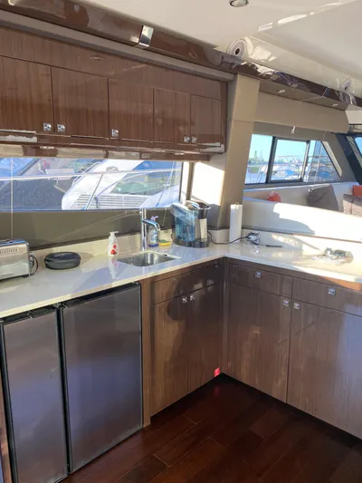  Yacht Photos Pics Luxurious kitchen interior of 2021 Carver C52 Command Bridge yacht.