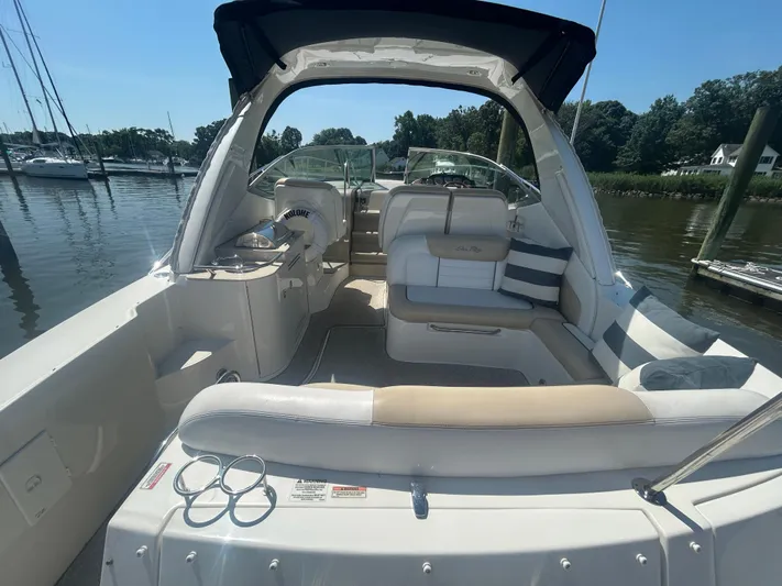  Yacht Photos Pics 2008 Sea Ray 330 Sundancer boat interior with seating, docked at marina.