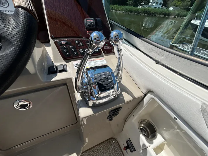  Yacht Photos Pics 2008 Sea Ray 330 Sundancer helm with dual throttle controls and steering wheel.