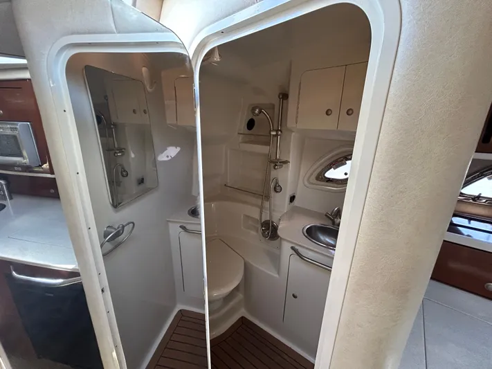  Yacht Photos Pics 2008 Sea Ray 330 Sundancer bathroom with shower, sink, and mirror.