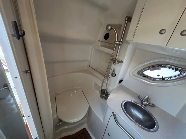  Yacht Photos Pics 2008 Sea Ray 330 Sundancer bathroom with toilet, sink, and showerhead.