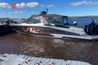 2022 Anytec A30 X-Tnd boat docked, featuring V12 engine, under clear blue sky.