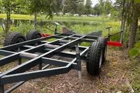 Trailer frame near a lake, surrounded by greenery, for Anytec A30 X-Tnd 2022.