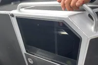 2022 Anytec A30 X-Tnd boat detail with hand on metal railing.