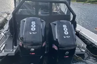 Anytec A30 X-Tnd 2022 boat with dual Mercury 600 V12 engines docked by the water.