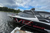 2022 Anytec A30 X-Tnd boat with V12 engine, 1200HP, docked on a lake.