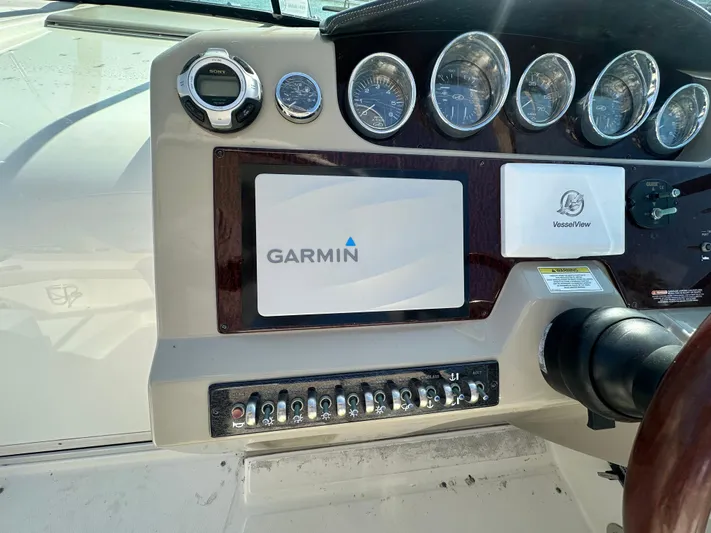  Yacht Photos Pics Control panel of 2013 Sea Ray 370 Venture with Garmin display and gauges.
