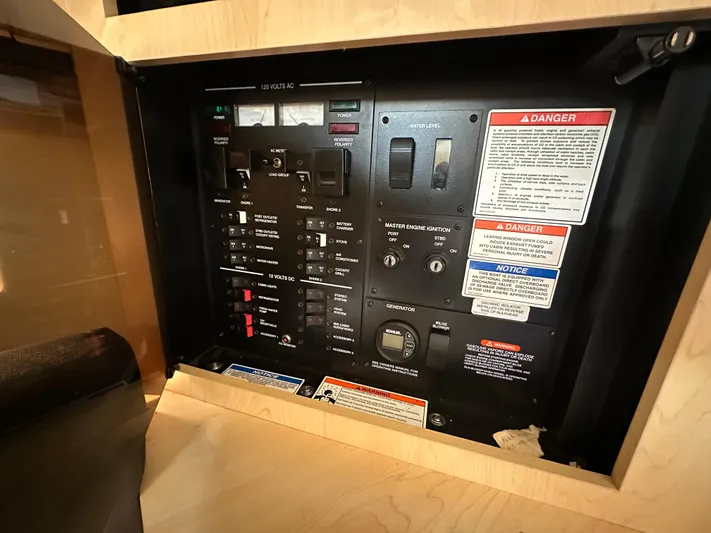  Yacht Photos Pics Control panel of a 2013 Sea Ray 370 Venture boat with warning labels.