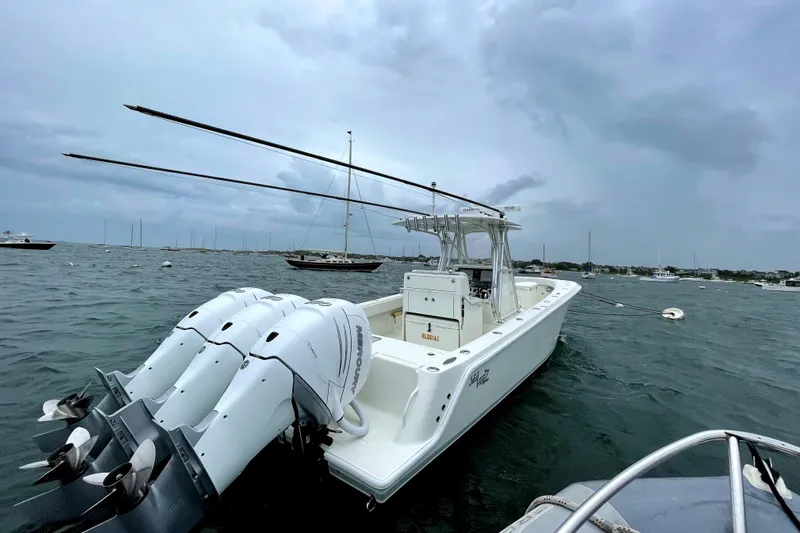  Yacht Photos Pics 2016 SeaVee 340Z boat with triple outboard engines on a cloudy day.