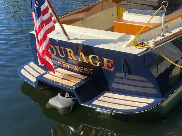 Courage Yacht Photos Pics Hinckley 36 Classic 1998 boat stern with American flag, docked in Key West waters.