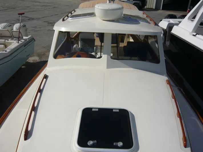 Courage Yacht Photos Pics 1998 Hinckley 36 Classic boat with white deck and wooden accents.