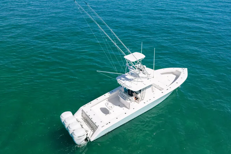  Yacht Photos Pics 2006 Venture 39 Open boat on clear blue water, aerial view.