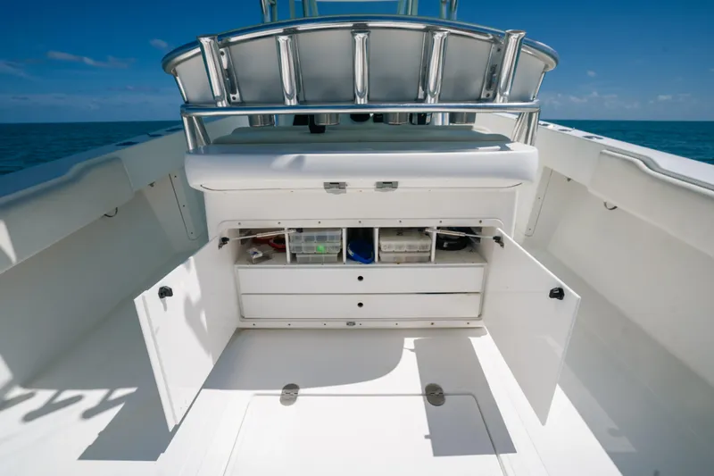  Yacht Photos Pics 2006 Venture 39 Open boat interior with open storage compartments, ocean view.