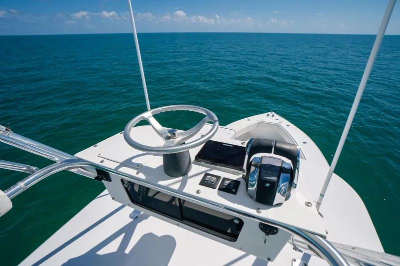 Yacht Photos Pics 2006 Venture 39 Open boat helm with ocean view, featuring steering wheel and controls.