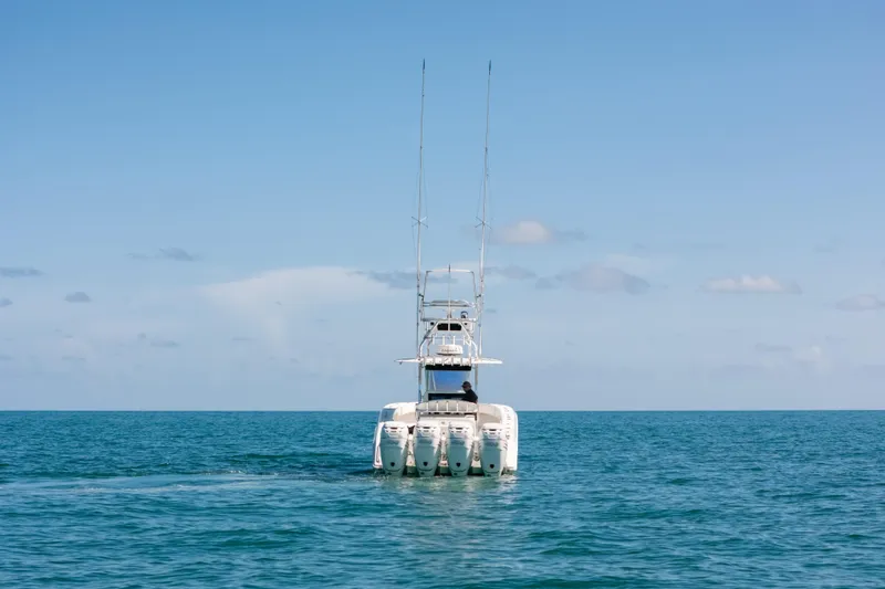  Yacht Photos Pics 2006 Venture 39 Open boat on calm ocean under clear blue sky.