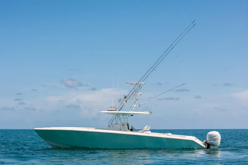  Yacht Photos Pics 2006 Venture 39 Open boat on calm ocean under clear blue sky.