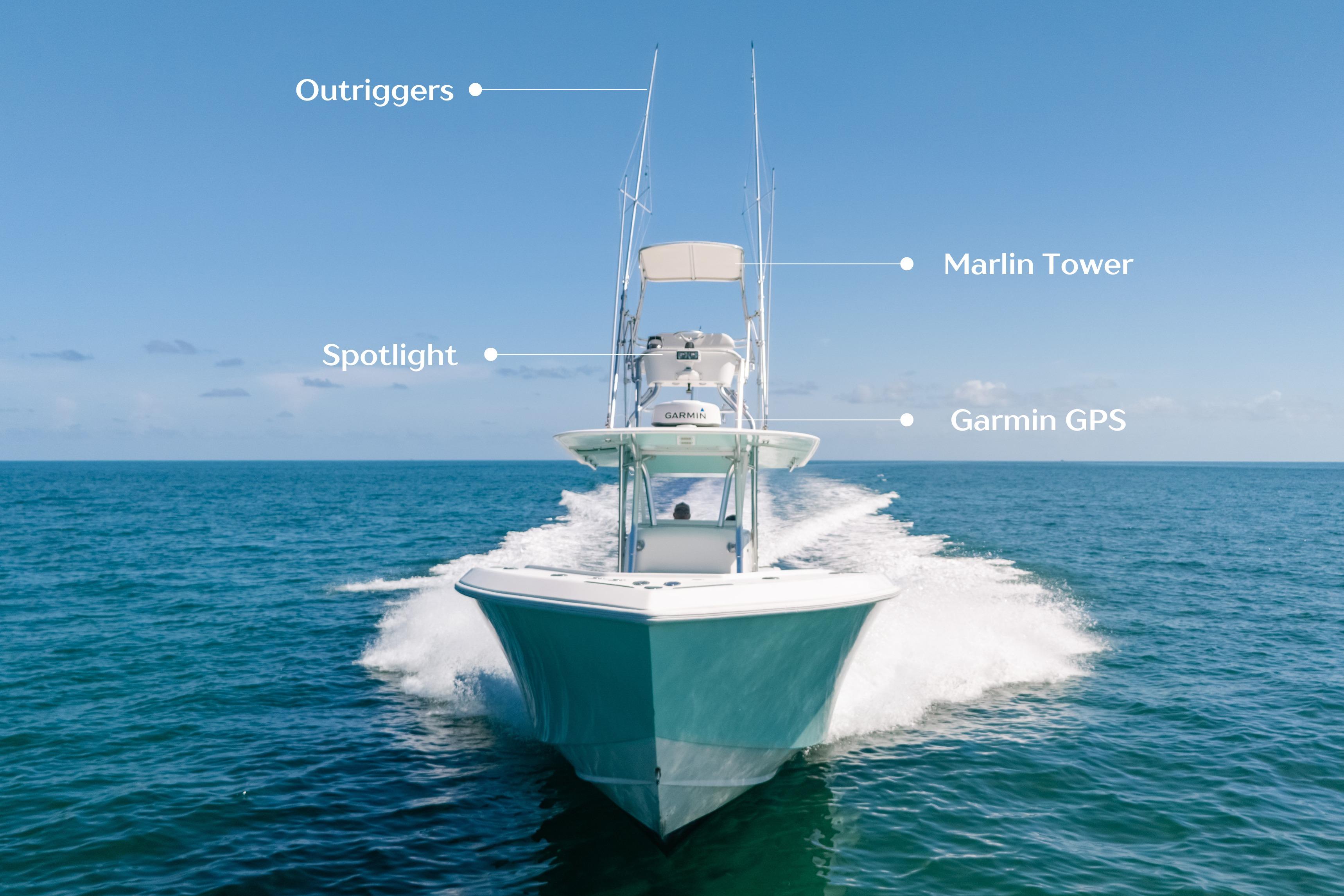 2006 Venture 39 Open boat with outriggers, marlin tower, spotlight, and Garmin GPS on open sea.