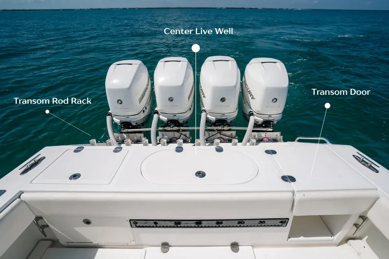  Yacht Photos Pics 2006 Venture 39 Open boat with four engines, transom rod rack, and center live well.