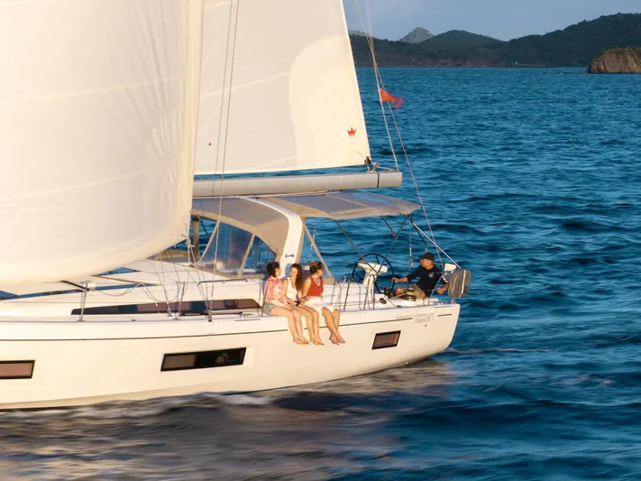 Sunday Girl Yacht Photos Pics 2024 Beneteau Oceanis 51.1 sailing with passengers on a sunny day.