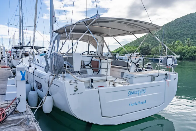 Sunday Girl Yacht Photos Pics 2024 Beneteau Oceanis 51.1 yacht docked in a scenic marina setting.