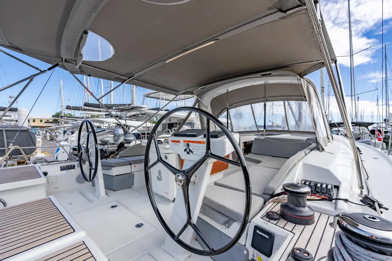 Sunday Girl Yacht Photos Pics 2024 Beneteau Oceanis 51.1 yacht cockpit with dual steering wheels and spacious seating.