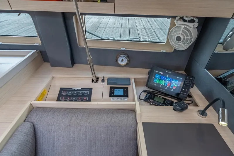 Sunday Girl Yacht Photos Pics Interior of 2024 Beneteau Oceanis 51.1 yacht with navigation equipment and control panel.