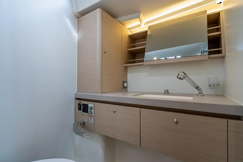 Sunday Girl Yacht Photos Pics Modern bathroom interior of 2024 Beneteau Oceanis 51.1 yacht with sleek fixtures and cabinetry.