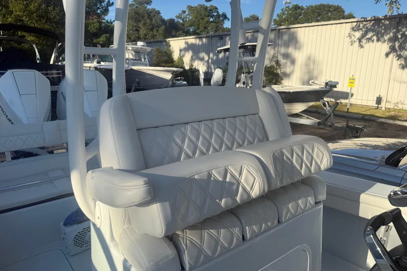  Yacht Photos Pics 2022 Yellowfin 26 Hybrid boat with luxurious quilted seating in a marina setting.