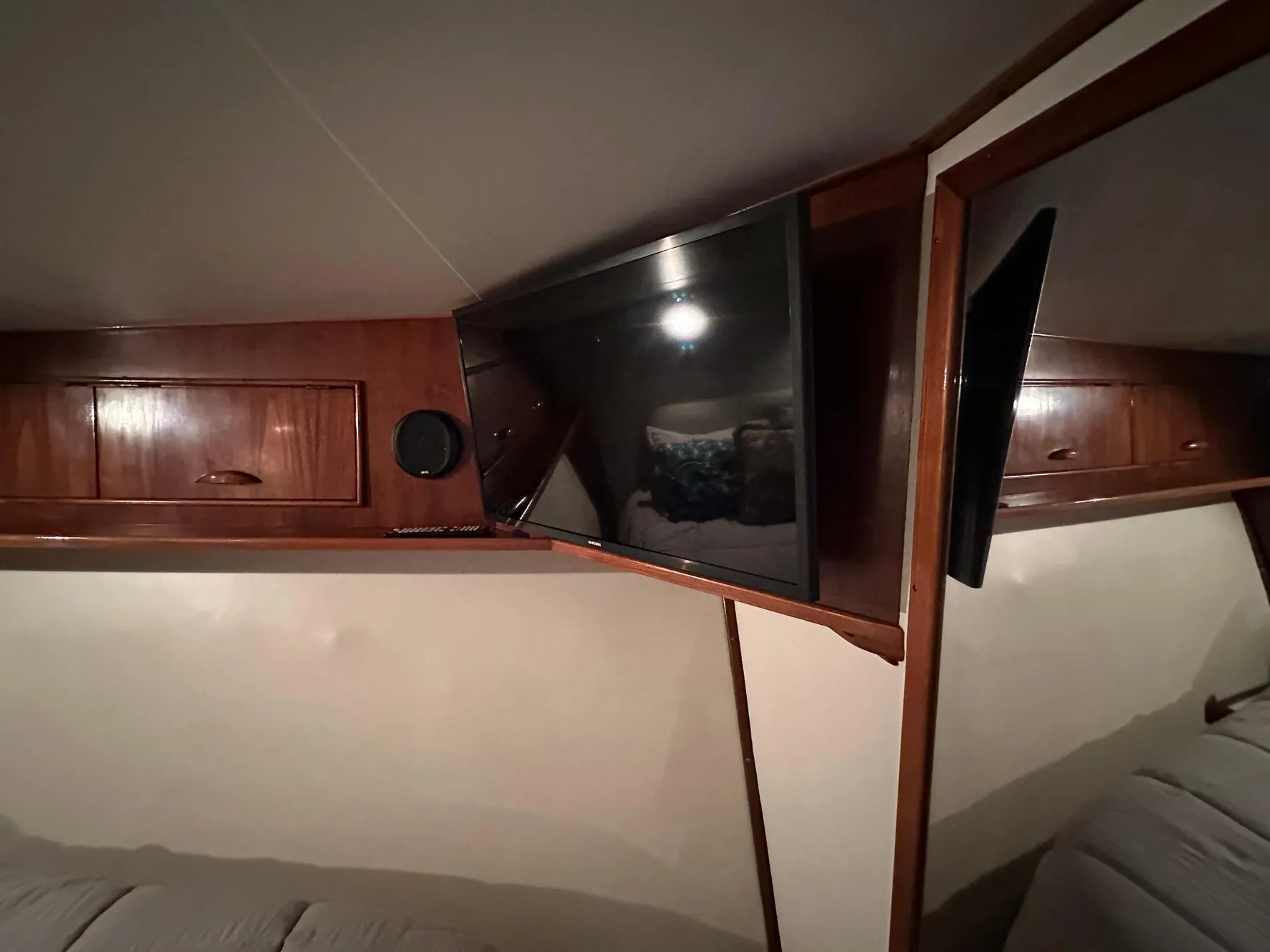 1988 Buddy Davis Convertible interior with TV and wooden cabinetry.