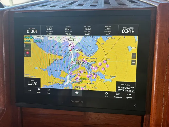 The Bottom Line Yacht Photos Pics Garmin navigation display on 1987 Hatteras Flybridge, showing nautical chart and GPS data.