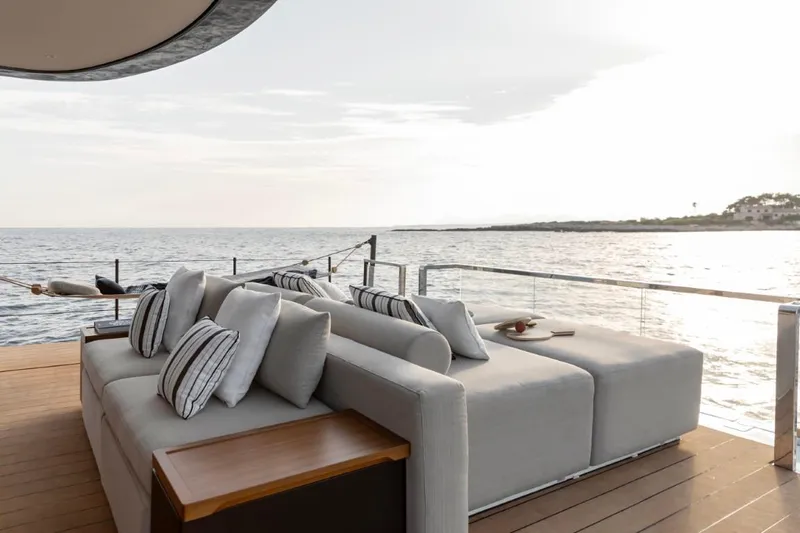  Yacht Photos Pics Luxurious deck of 2024 Azimut Seadeck 7 yacht with ocean view and comfortable seating.