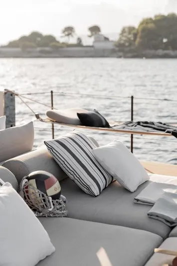  Yacht Photos Pics Luxurious Azimut Seadeck 7 yacht deck with cushions, overlooking serene waters, 2024 model.