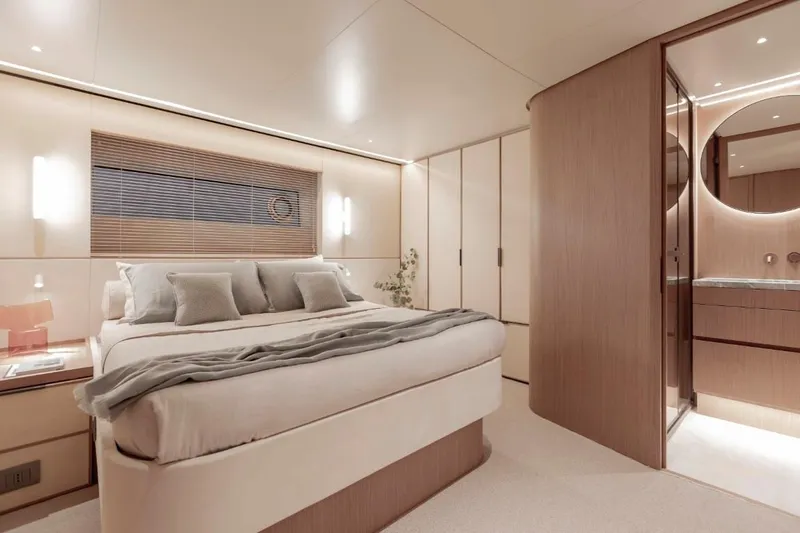  Yacht Photos Pics Luxurious bedroom interior of 2024 Azimut Seadeck 7 yacht, featuring modern design and elegant furnishings.