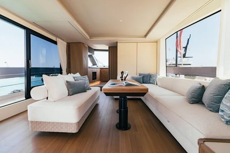  Yacht Photos Pics Luxurious interior of 2025 Azimut Seadeck 7 yacht with elegant seating and panoramic windows.