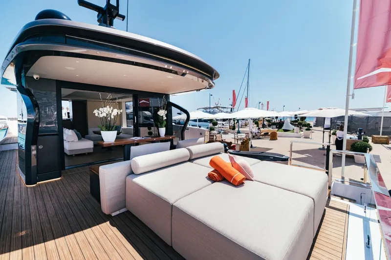  Yacht Photos Pics Luxurious 2025 Azimut Seadeck 7 yacht with elegant outdoor lounge area and modern design.