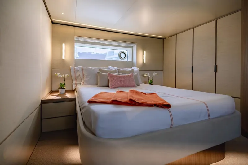  Yacht Photos Pics Luxurious bedroom interior of 2025 Azimut Seadeck 7 yacht with modern design and elegant decor.